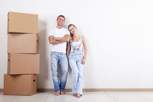 Removal team planning a house move in Surrey with boxes and furniture
