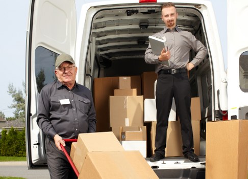 Moving team sorting recyclable packing materials in Surrey