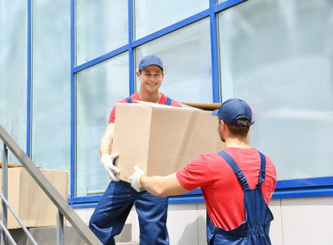Removal team planning a flat move in a Surrey apartment building