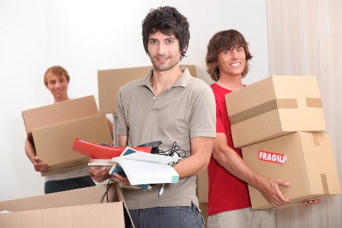 Home removals team loading furniture for a Surrey house move
