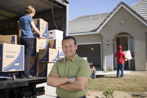 Professional movers in Surrey packing fragile household belongings