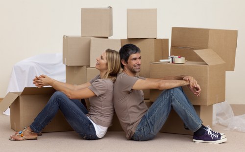 Team loading furniture into a moving truck in Surrey