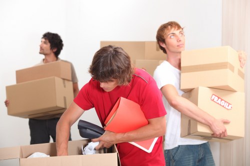 Furniture and boxes being loaded into a van in Surrey