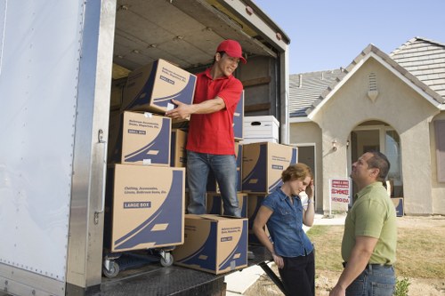 Loading boxes and furniture into a removal truck for a move in Surrey