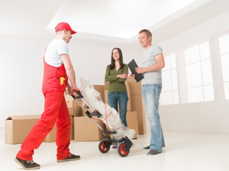 Boxes and furniture prepared for a flat removal service in Surrey
