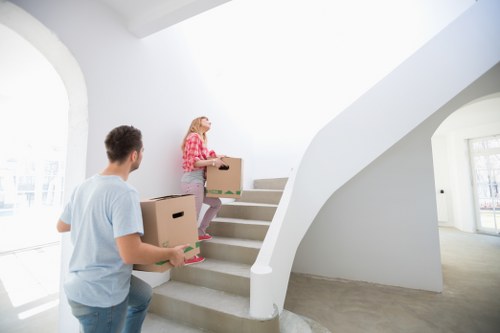 Careful loading of household items during a Surrey flat move