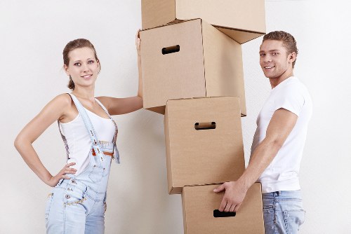 Surrey movers placing boxes into a new home during move-in