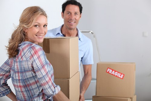 Movers handling furniture carefully during a Surrey home move