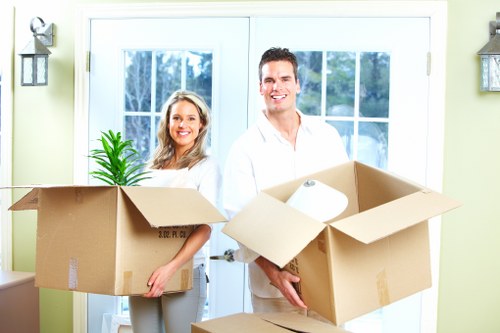 Packed office boxes and furniture ready for loading