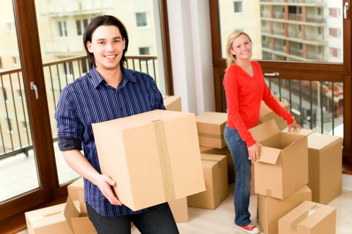 Business relocation team transporting office equipment in Surrey