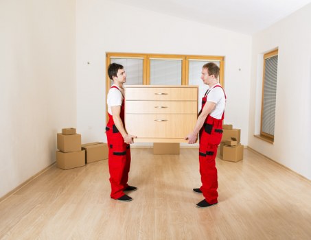 Moving professionals in Surrey discussing property protection and insurance